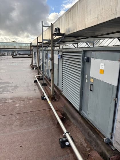 Row of air handling units on rooftop at Newton Mearns