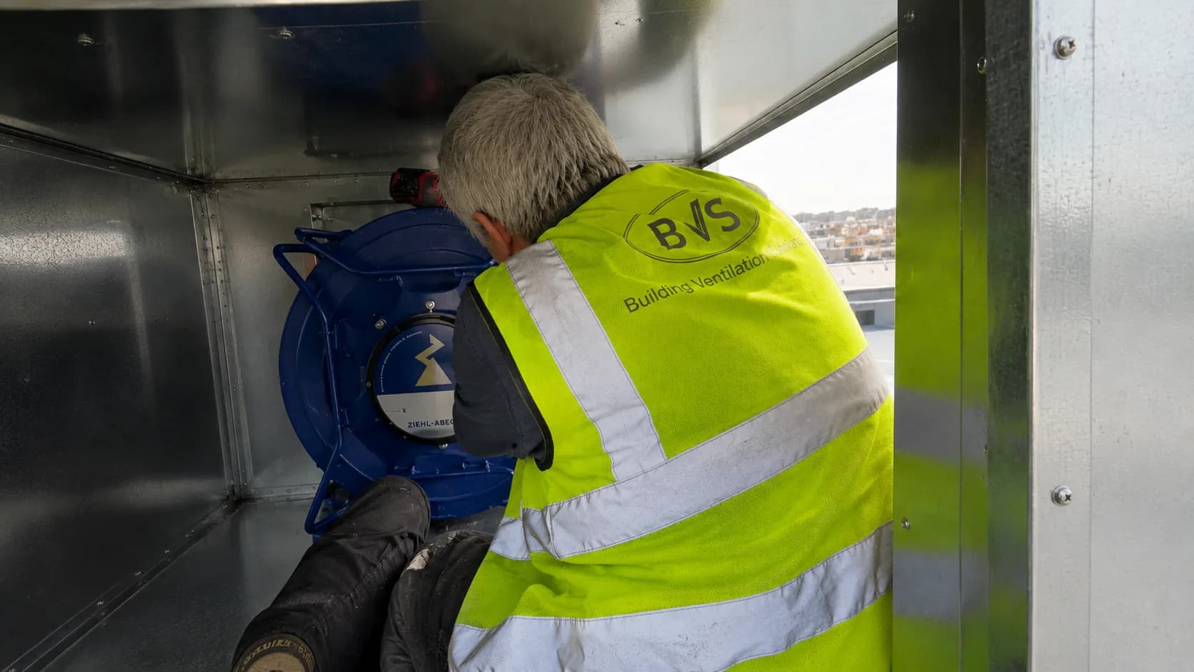 BVS engineer working on ventilation equipment