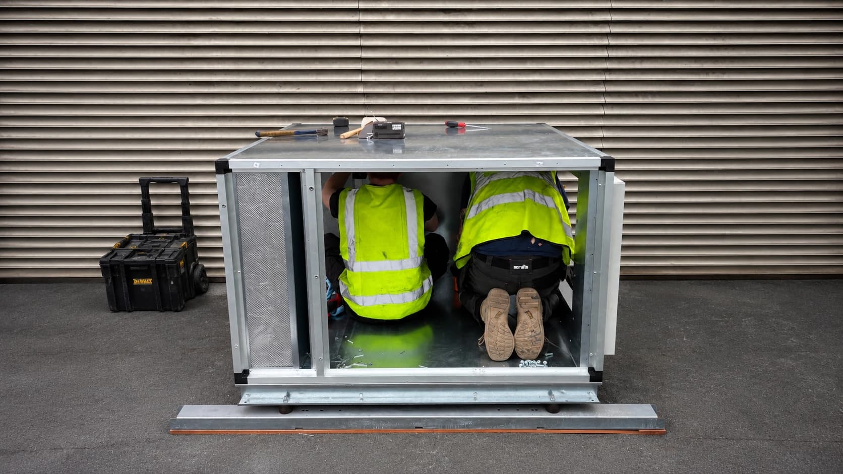 BVS engineers working inside an air handling unit