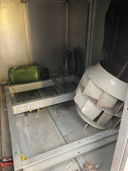 Old belt-drive fan being removed from operating theatre AHU at Bath private hospital