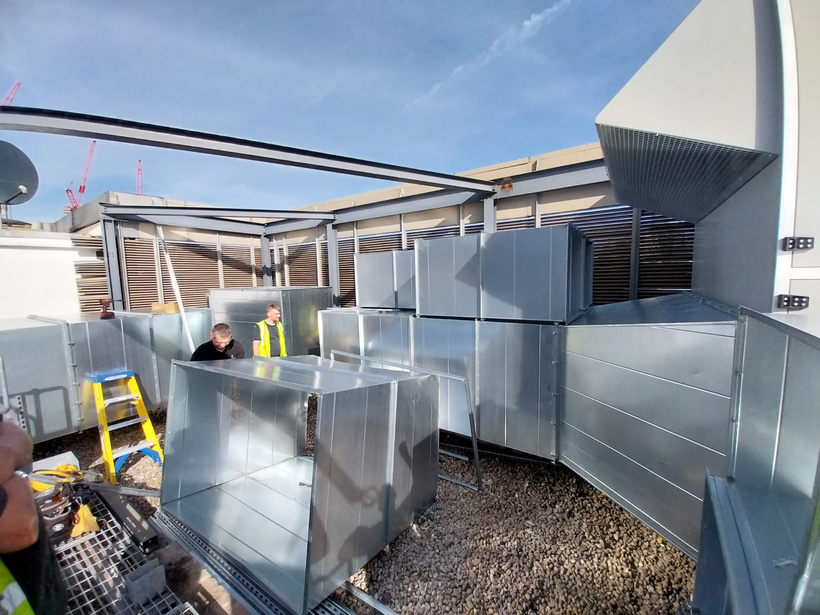 BVS engineers connecting ductwork to the installed AHUs on the Blackfriars office rooftop