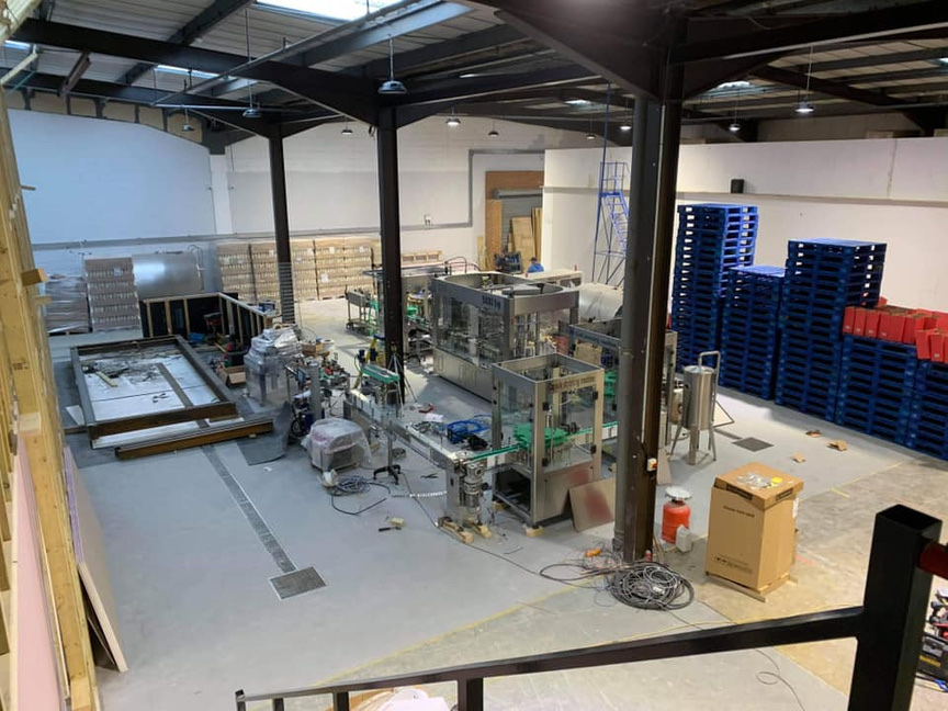 RED Distillery production floor interior showing the active manufacturing environment
