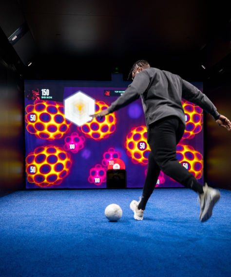 Player using the TOCA Social football simulator at the O2 Arena, London
