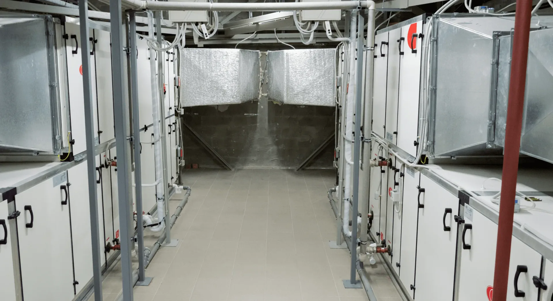 BVS engineer carrying out an AHU condition survey on-site