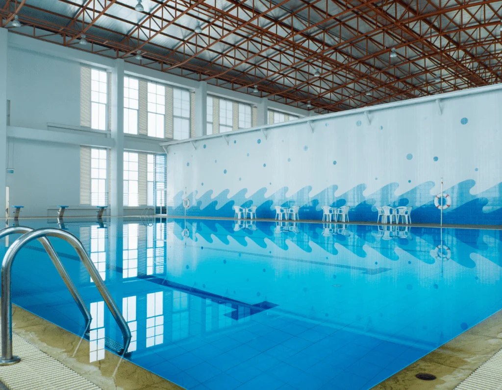50 metre indoor swimming pool with tinted blue tiles