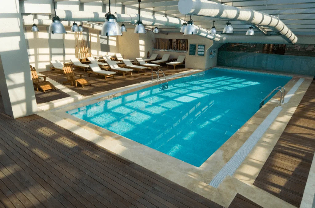 Luxury Indoor Swimming Pool with brown wooden flooring